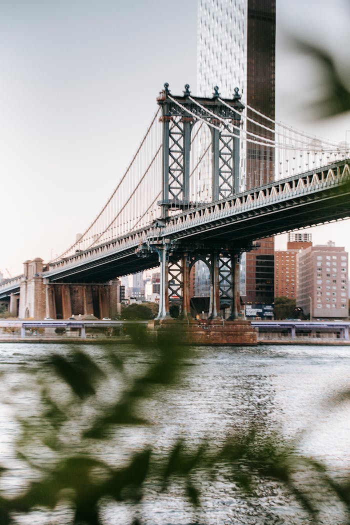 Famous Manhattan Bridge over East River located in New York City in daytime